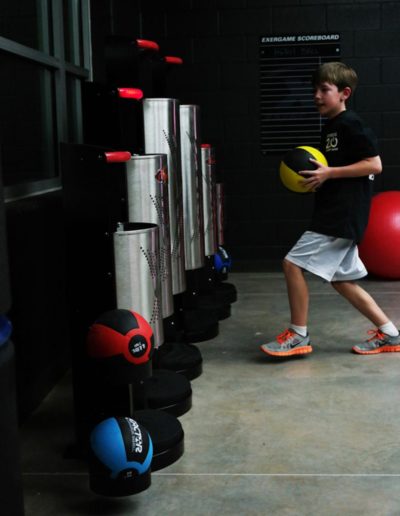 Young male active with Fit Interactive Heavy Ball system