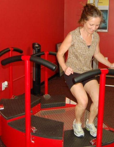 Female uses Exergame Jump Q interactive fitness gaming platform