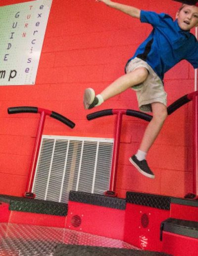 Young male uses Exergame Jump Q interactive fitness gaming platform